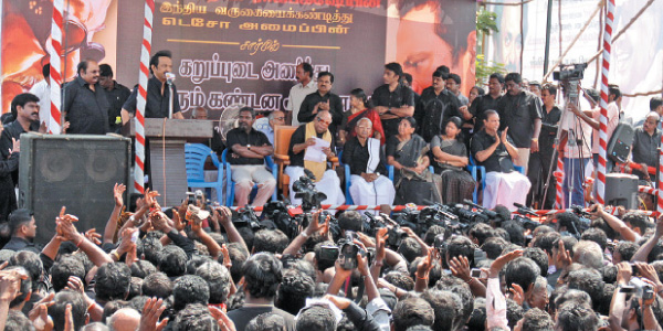 Wearing a black shirt and a demonstration to protest against the visit and comment Username